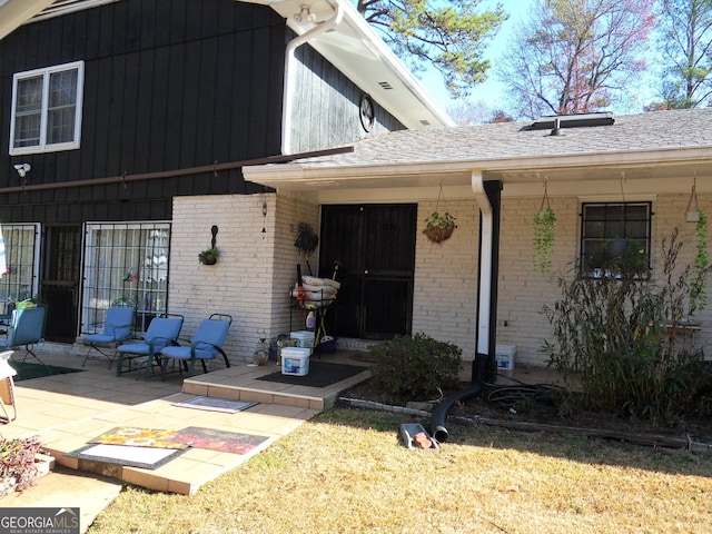 property entrance featuring a patio