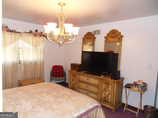 bedroom featuring an inviting chandelier