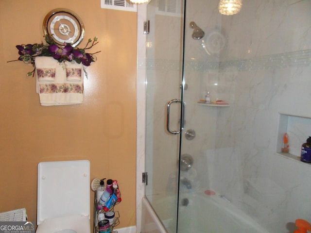 bathroom featuring enclosed tub / shower combo