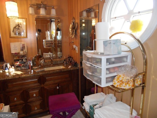 interior space featuring stone counters and sink