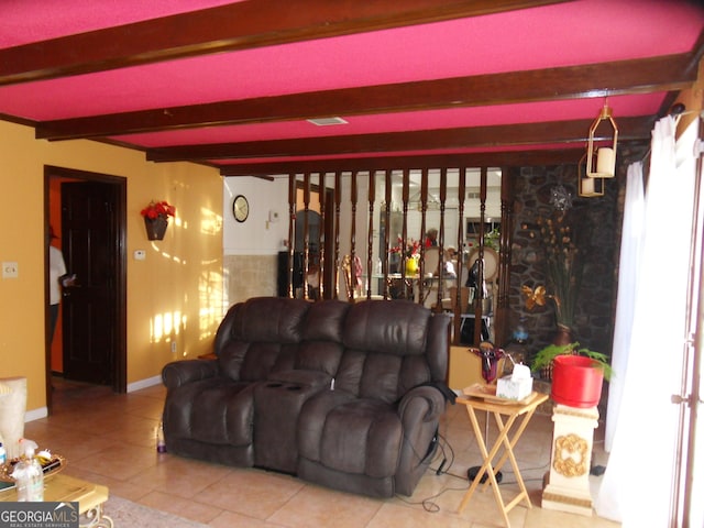 tiled living room featuring beamed ceiling