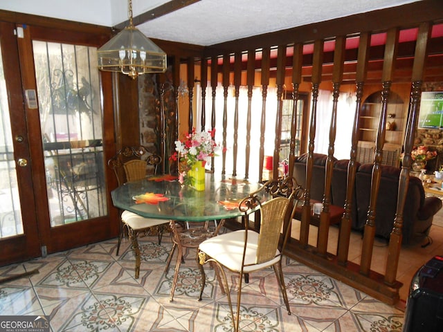 dining space with a chandelier