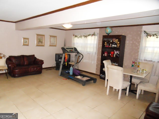 exercise area featuring crown molding