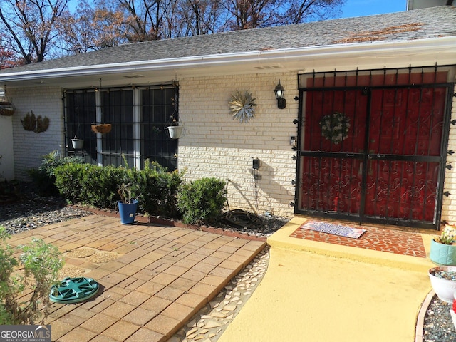 doorway to property with a patio