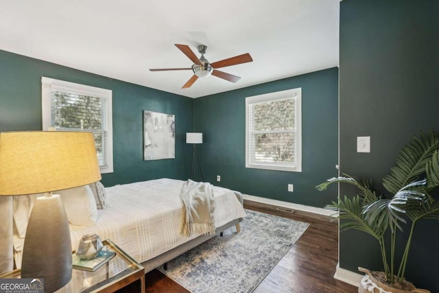 bedroom featuring ceiling fan and dark hardwood / wood-style flooring