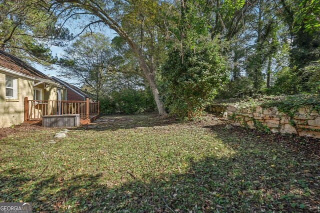 view of yard with a wooden deck