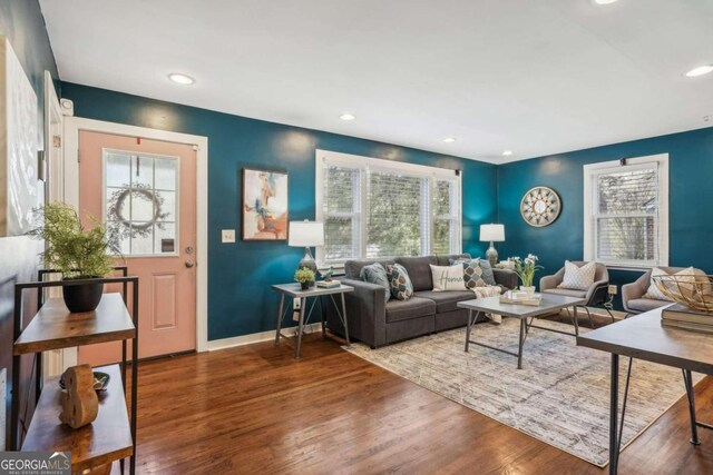 living room featuring hardwood / wood-style flooring and a healthy amount of sunlight