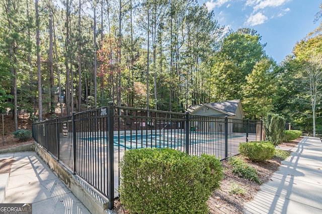 view of swimming pool with a patio