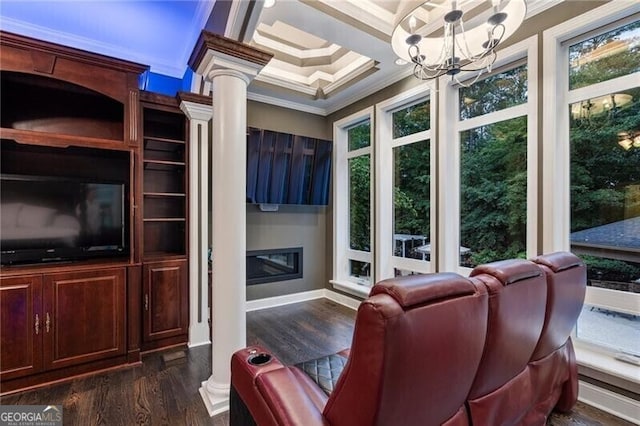 sunroom / solarium with a chandelier and ornate columns