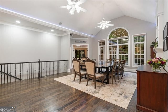 dining room featuring ceiling fan, dark hardwood / wood-style floors, and lofted ceiling