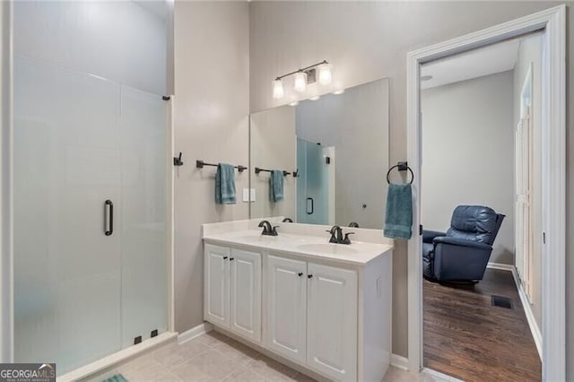 bathroom with walk in shower and vanity