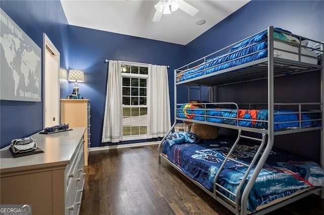 bedroom with ceiling fan and dark hardwood / wood-style floors