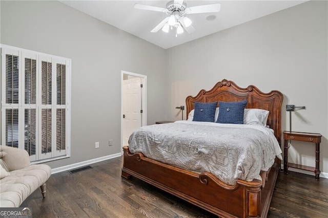 bedroom with ceiling fan and dark hardwood / wood-style flooring