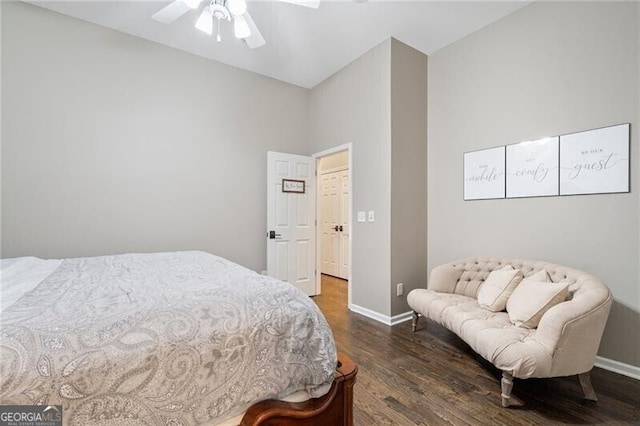 bedroom with ceiling fan and dark wood-type flooring