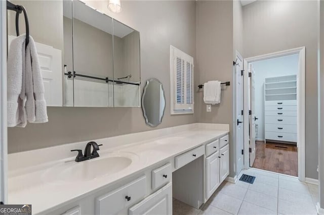 bathroom with vanity and tile patterned flooring