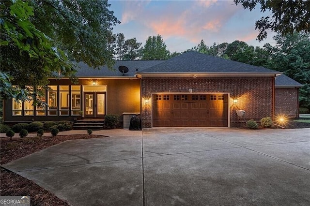 view of front of property with a garage