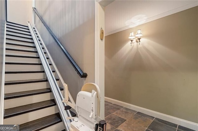 stairs featuring crown molding