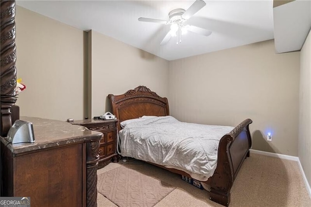 bedroom featuring ceiling fan and light carpet