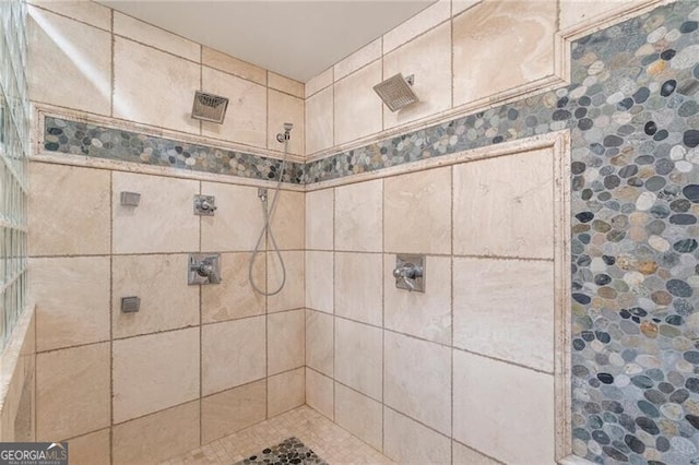 bathroom with a tile shower