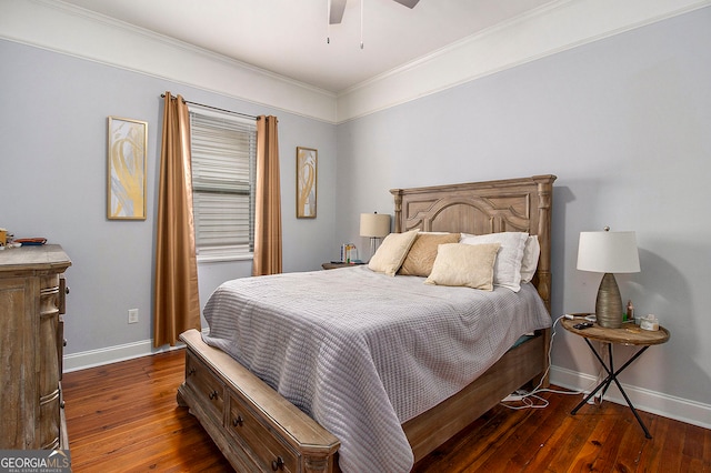 bedroom with dark hardwood / wood-style floors, ceiling fan, and ornamental molding