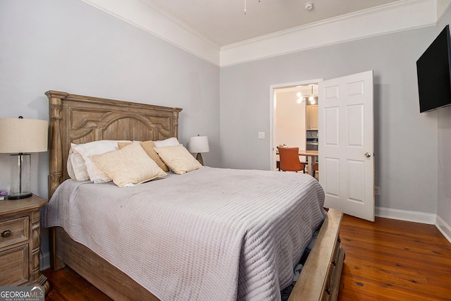 bedroom featuring ornamental molding and dark wood-type flooring