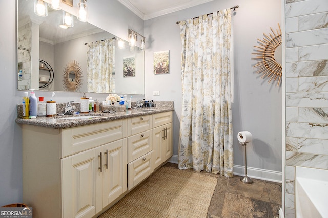 bathroom with vanity, a bathtub, and crown molding