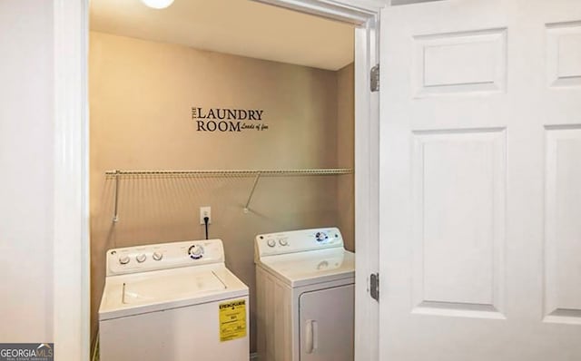 laundry area with washing machine and dryer