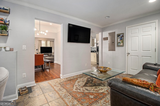 living room with crown molding, light hardwood / wood-style floors, and a notable chandelier