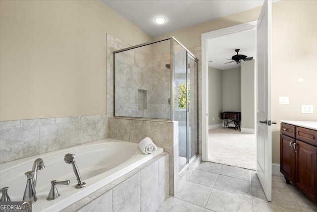 bathroom featuring tile patterned flooring, vanity, ceiling fan, and independent shower and bath