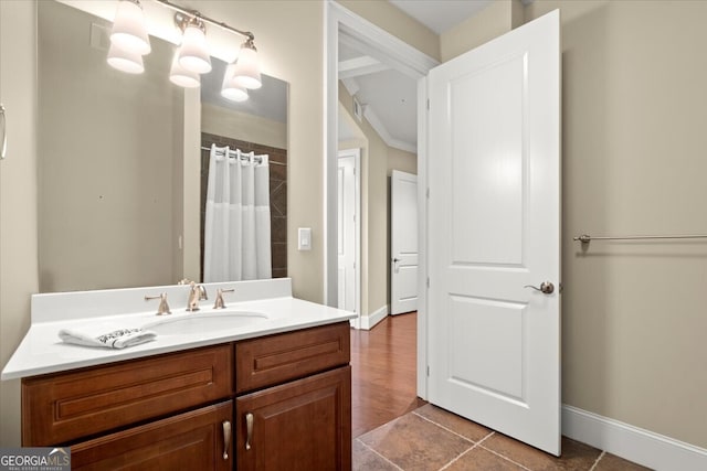 bathroom with a shower with curtain, vanity, and tile patterned floors