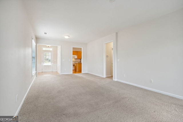 empty room featuring light colored carpet