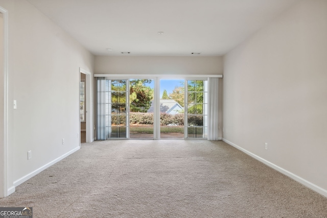 spare room featuring carpet floors