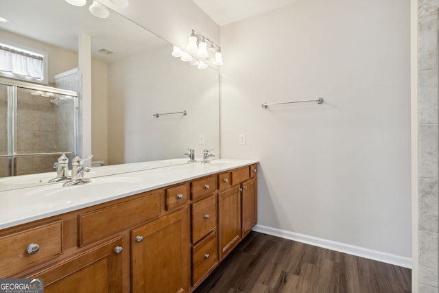 bathroom featuring vanity, hardwood / wood-style flooring, toilet, and walk in shower