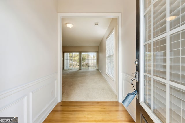 corridor featuring wood-type flooring