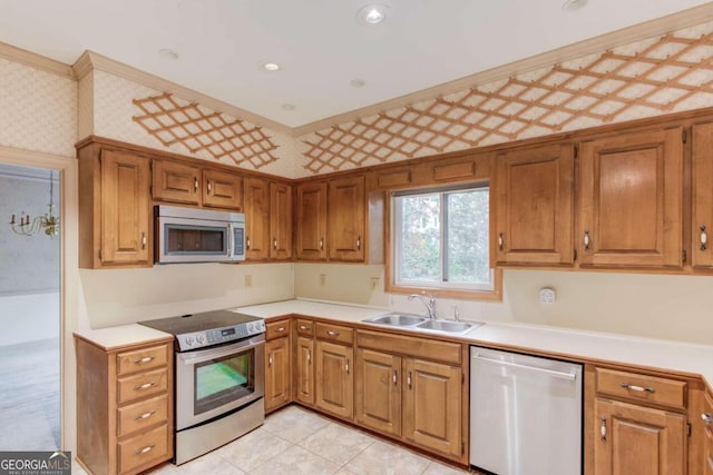 kitchen featuring light tile patterned flooring, appliances with stainless steel finishes, and sink