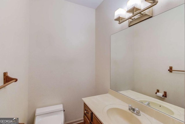 bathroom with vanity and toilet