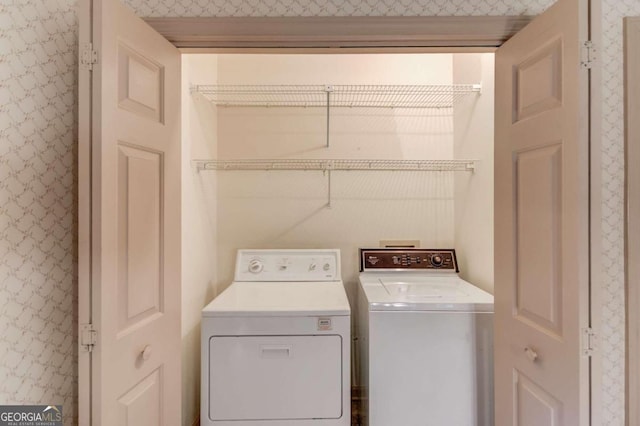 washroom featuring washer and dryer