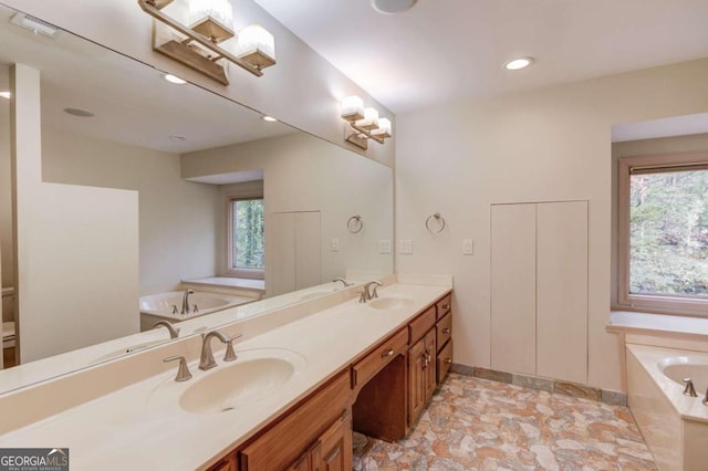 bathroom featuring a bathing tub and vanity