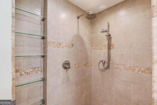 bathroom with a tile shower