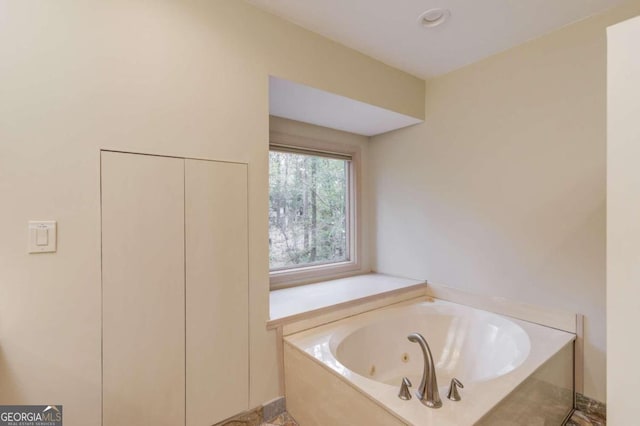 bathroom featuring a tub to relax in