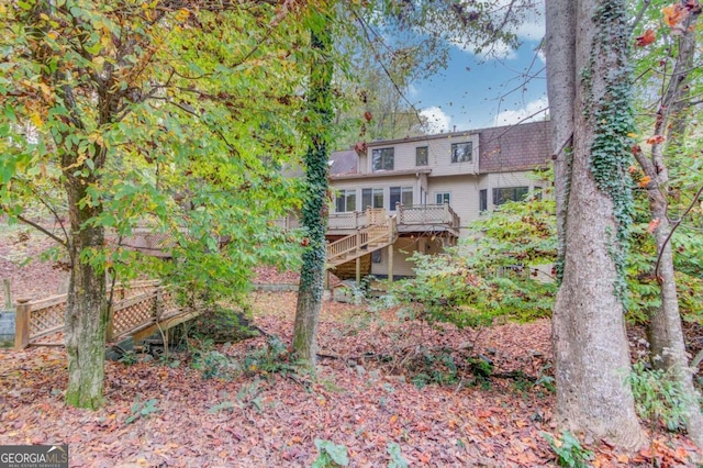 back of property with a wooden deck