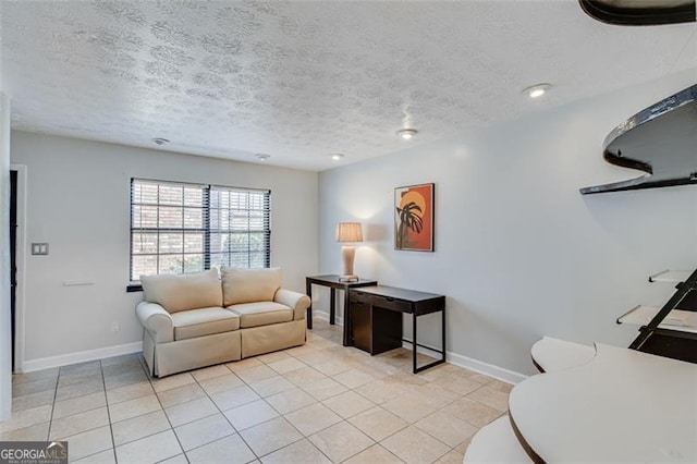 tiled living room with a textured ceiling