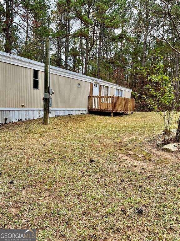 view of yard featuring a wooden deck