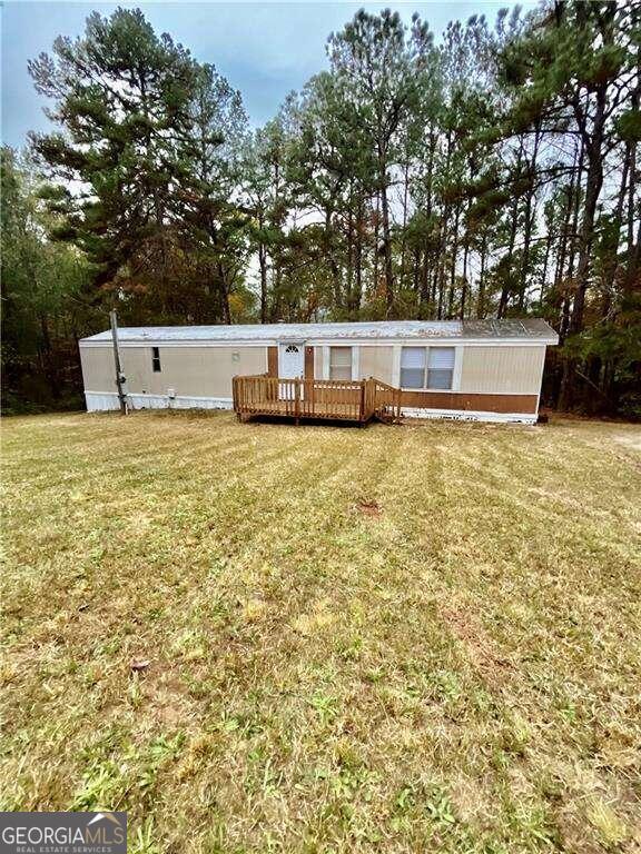 view of yard with a wooden deck