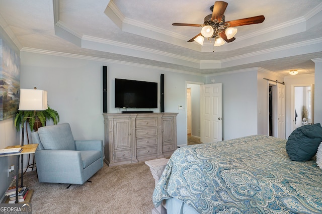 bedroom with a tray ceiling, ceiling fan, crown molding, and light colored carpet