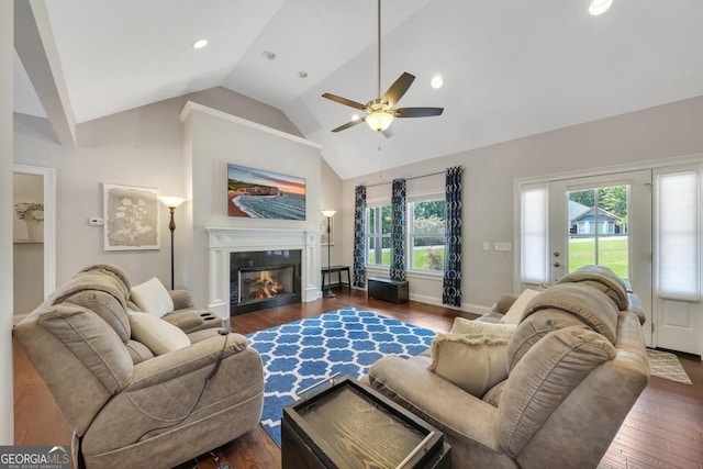 living room featuring high vaulted ceiling, ceiling fan, and dark wood-type flooring