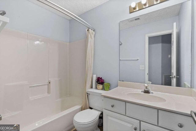 full bathroom with vanity, shower / bath combination with curtain, toilet, and a textured ceiling