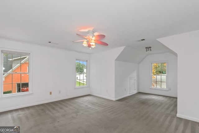 additional living space with carpet flooring and ceiling fan