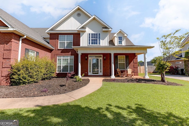 view of front facade featuring a porch and a front yard