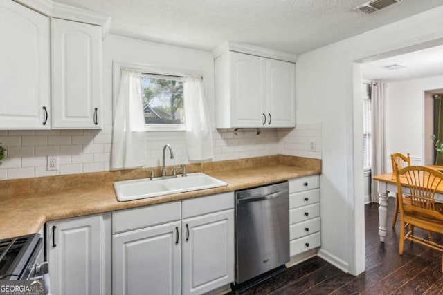 kitchen featuring white cabinets, appliances with stainless steel finishes, dark wood-type flooring, and sink